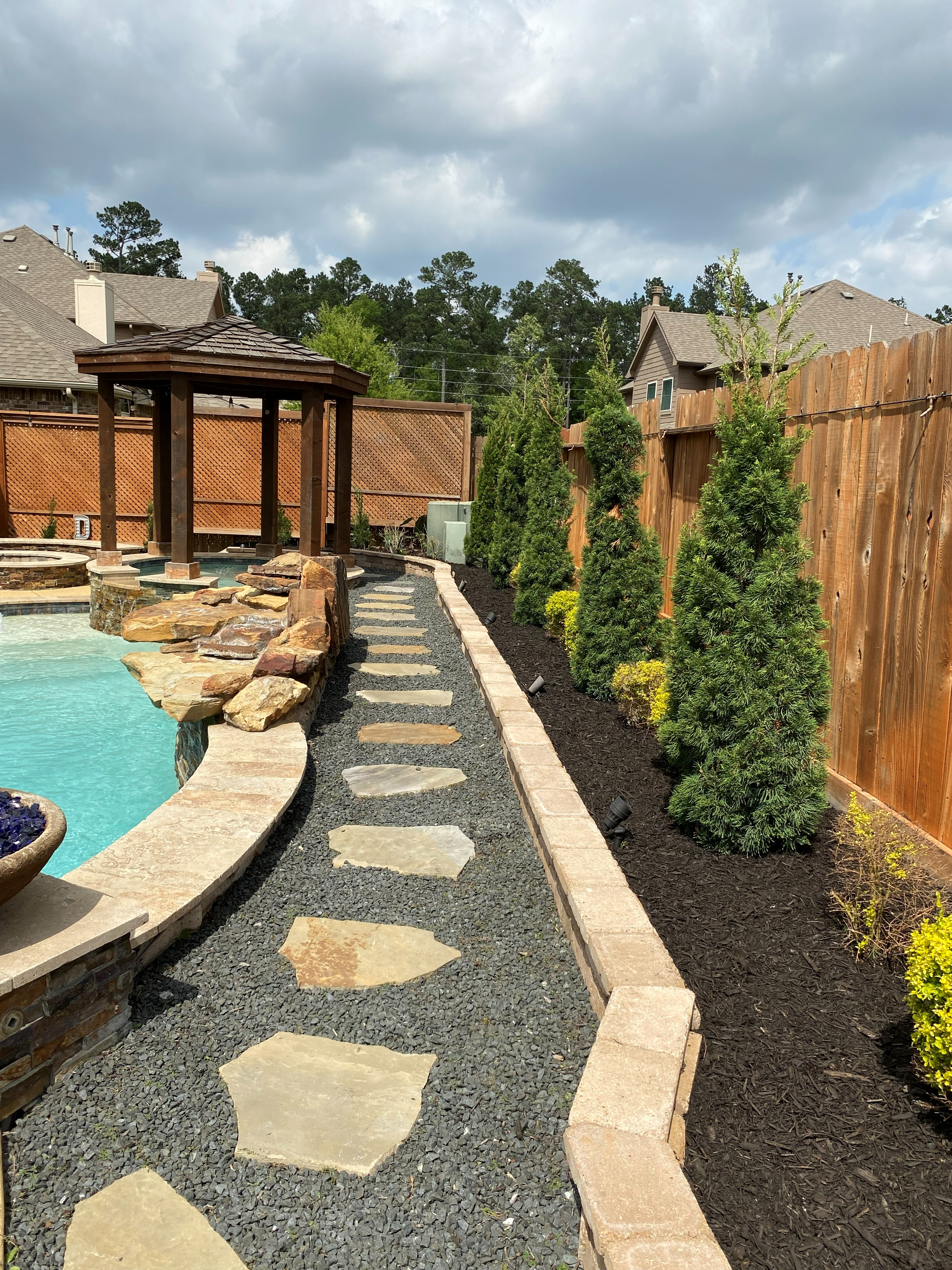 Poolside hardscape and landscape Houston TX
